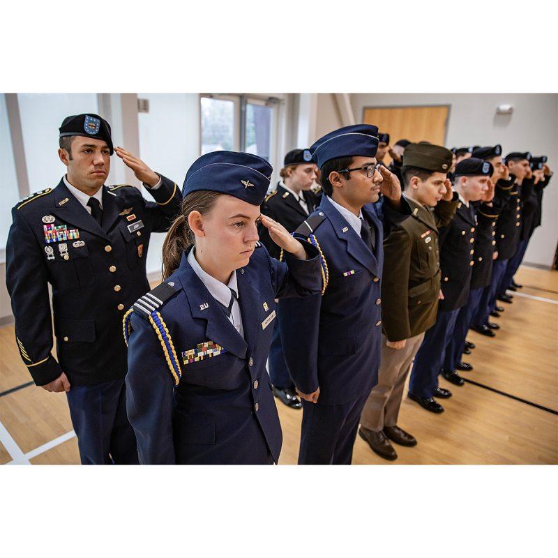 UNC ROTC members salute during the pledge of allegiance.